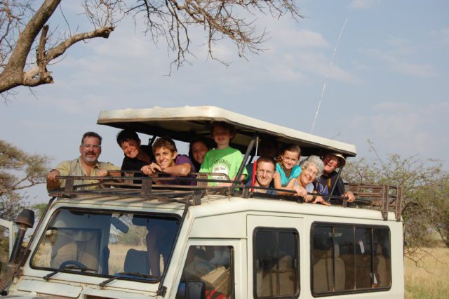 a family in Africa exploring their family reunion destination
