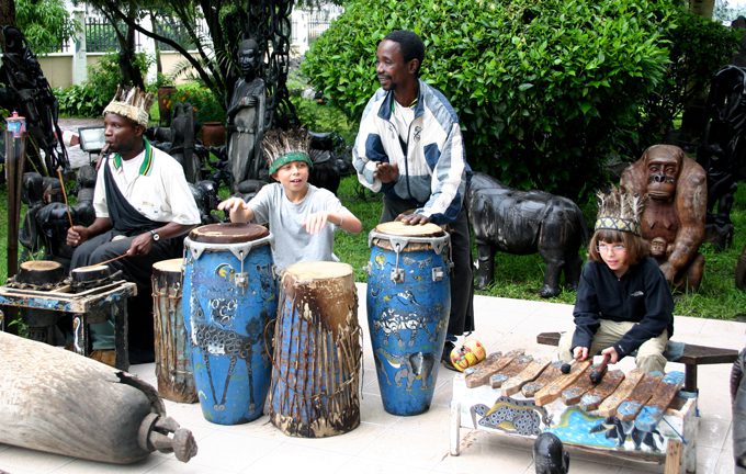kids playing the hand drums on a family safari