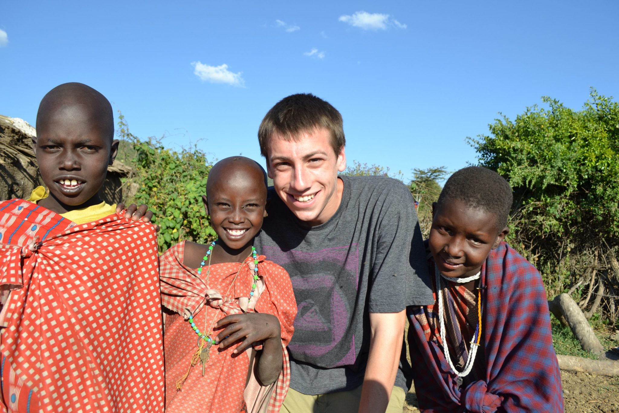 taking a photo with Maasai children on a family safari
