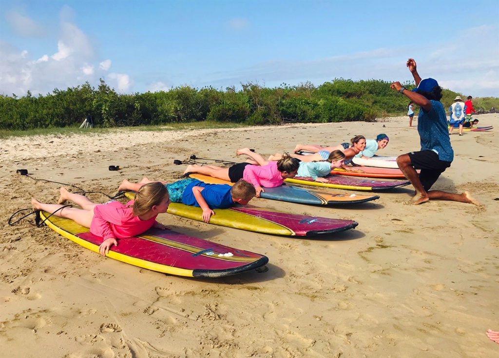 family surf lessons in galapagos