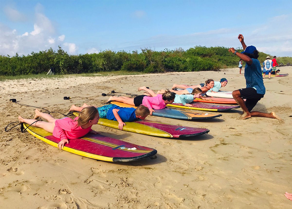 family surf lessons in galapagos