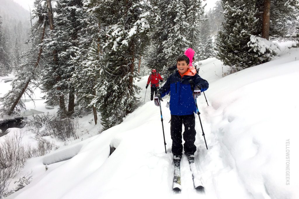 cross country skiing family on vacation in yellowstone