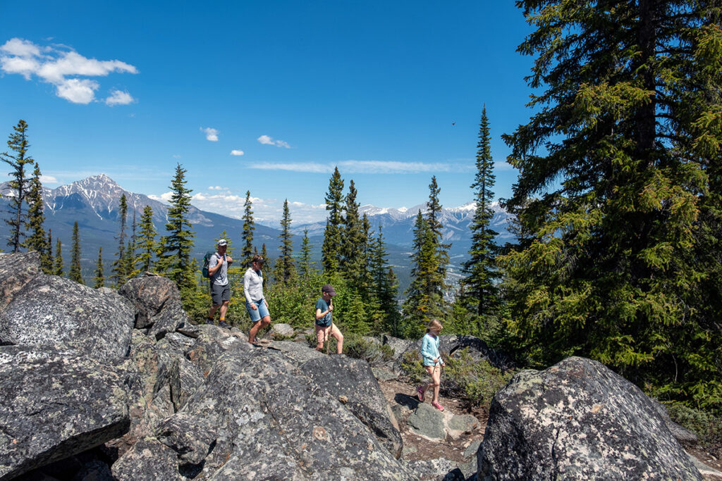 family hiking through canadian rockies